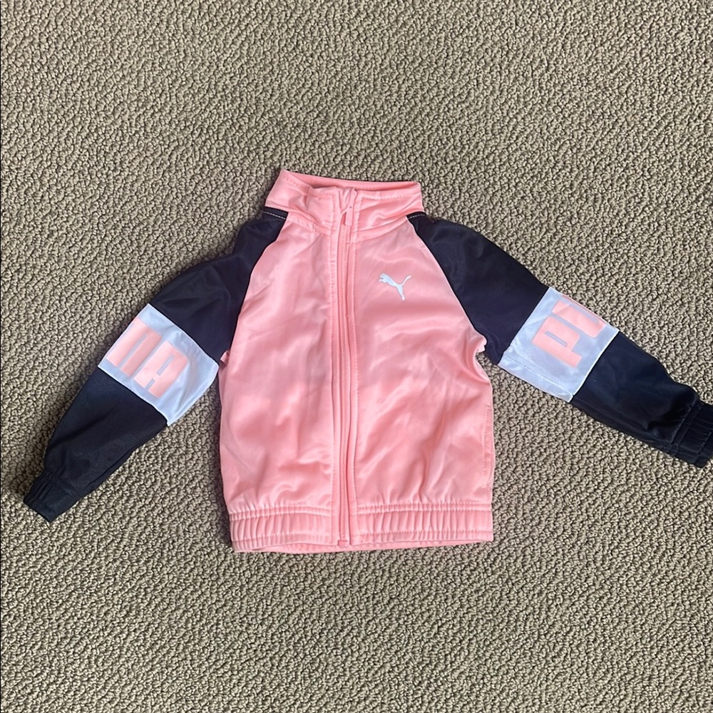 Puma jacket with Puma on the sleeves